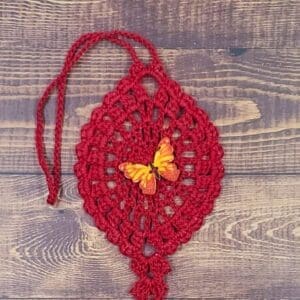 Sun Flare Butterfly on Red Flutter Charm